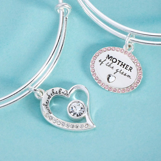 Mother of the Groom Bangle by Alex and Ani, silver bracelet with pink crystal charm on turquoise background on Tampa Home & Garden Store