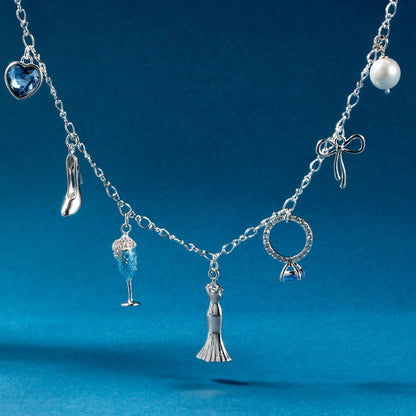 Bridal multi-charm necklace with blue heart gemstone, pearl bead, and silver charms on Tampa Home & Garden Store