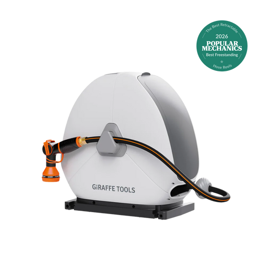 Ground Mounted Retractable Hose Reel by Giraffe Tools; white housing, orange hose, base mount on Tampa Home & Garden Store