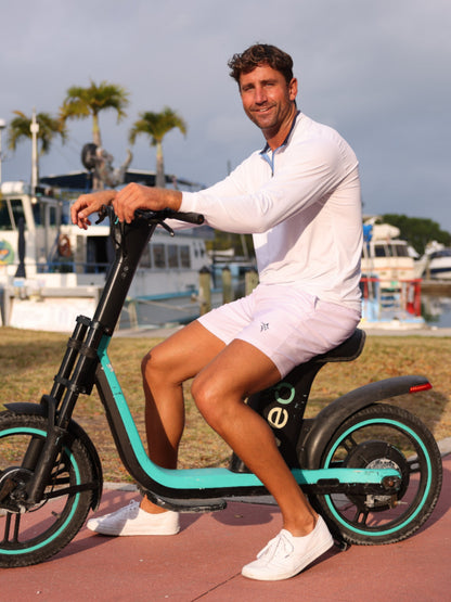 Freeport Short Effortless Performance light pink shorts by White Water Life on an e-scooter on Tampa Home & Garden Store