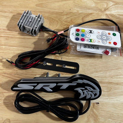 Jeep Trackhawk RGBW Flow Series LED grill emblem with remote, silver heatsink, black plate on Tampa Home & Garden Store