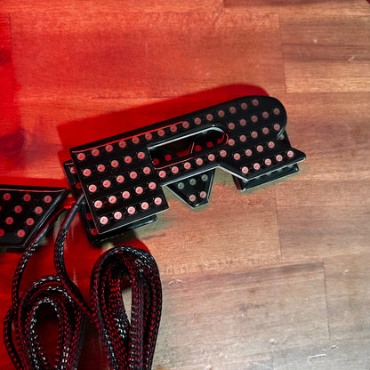 RAM RGBW Flow LED badge emblems in black housing with red glow for interior exterior use on Tampa Home & Garden Store