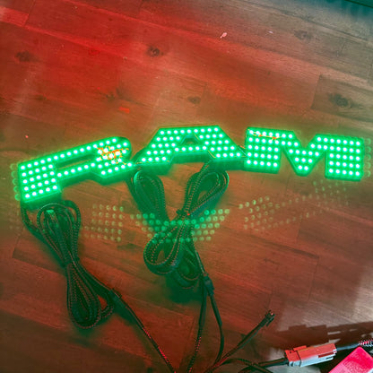 RAM RGBW Flow LED badge emblem logo by AutoLEDTech.com for interior exterior use, green LEDs on Tampa Home & Garden Store