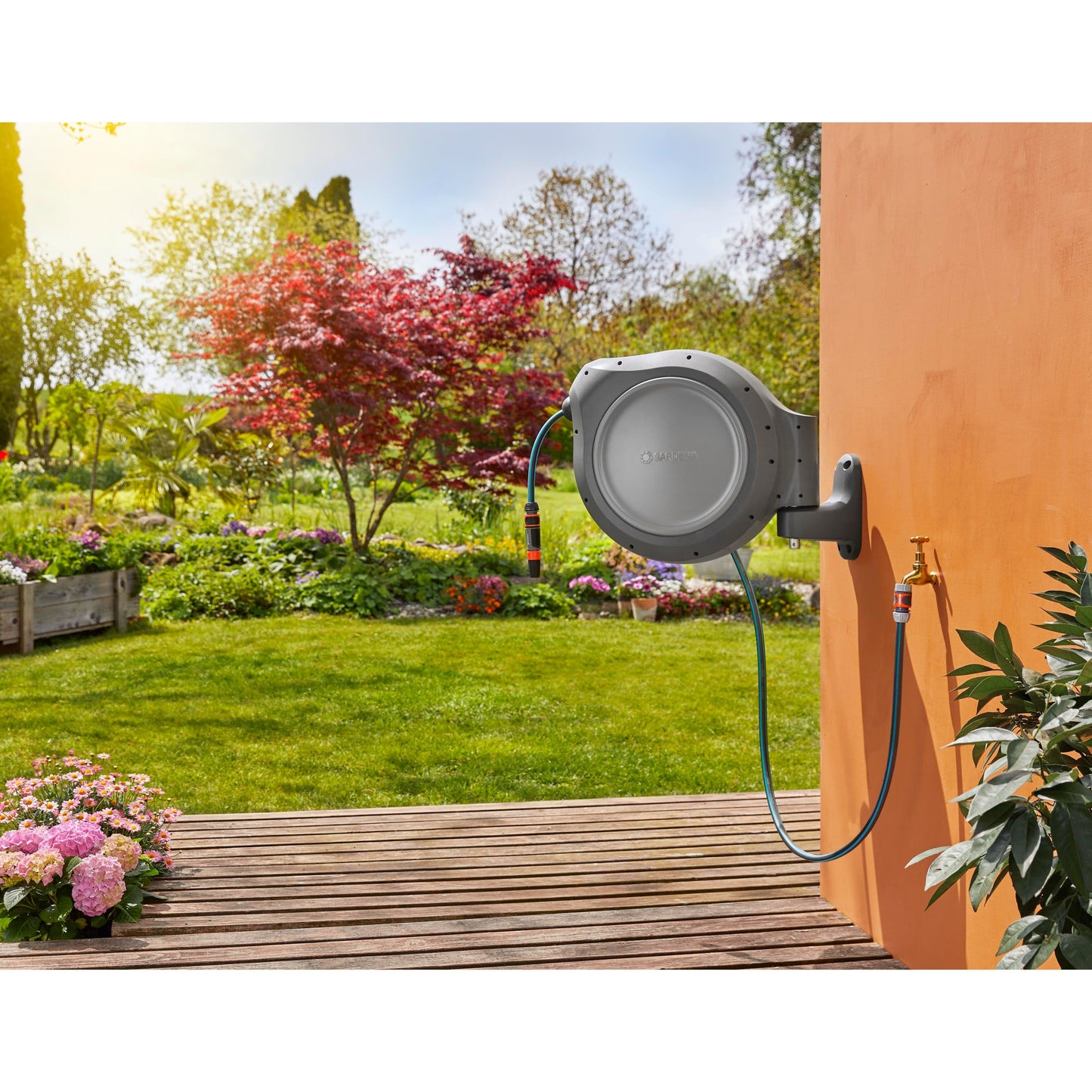 Gardena retractable hose reel 50 ft gray housing with blue hose, wall-mount unit on Tampa Home & Garden Store