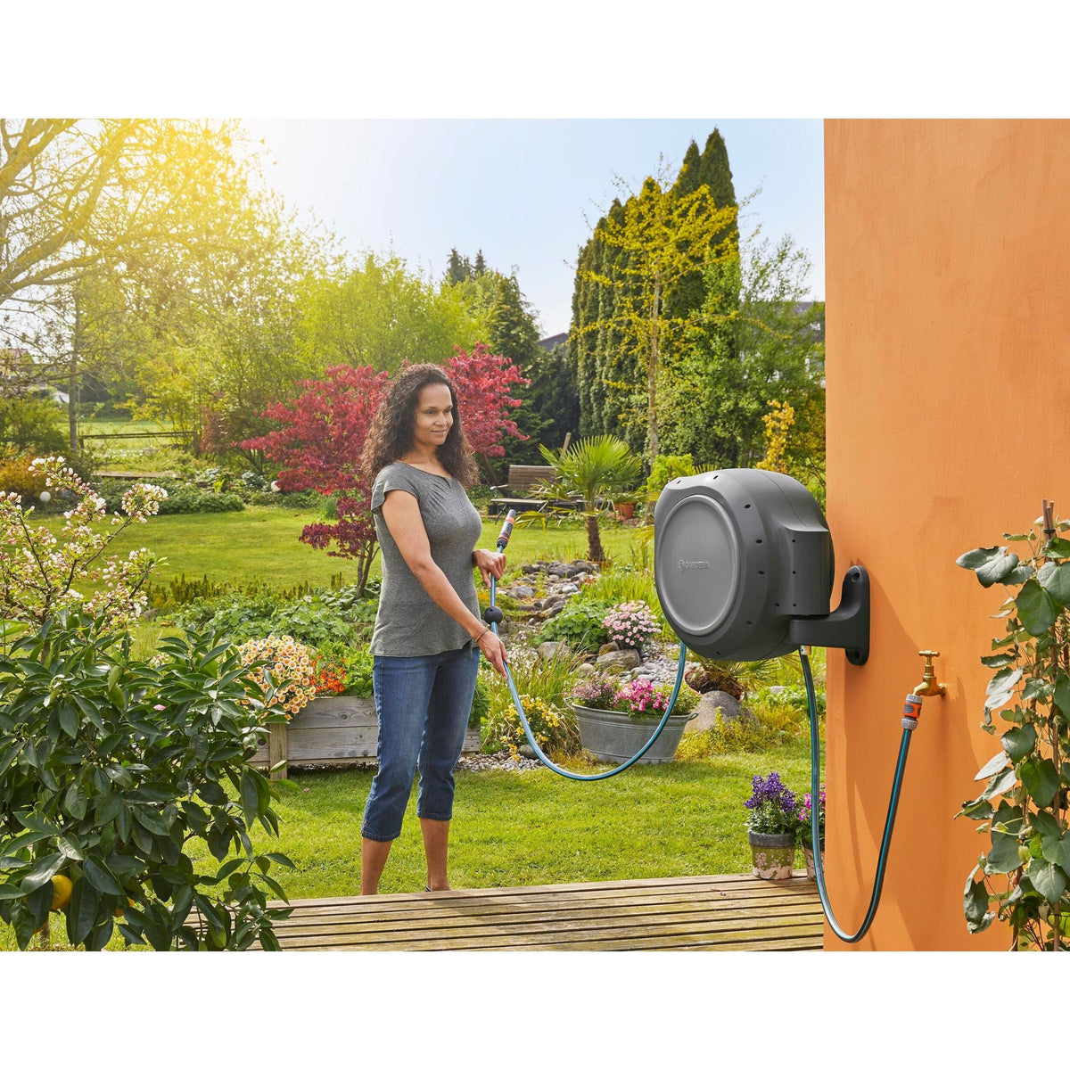 Gardena RollUp 100 ft auto retracting hose reel, gray housing, wall-mounted on Tampa Home & Garden Store