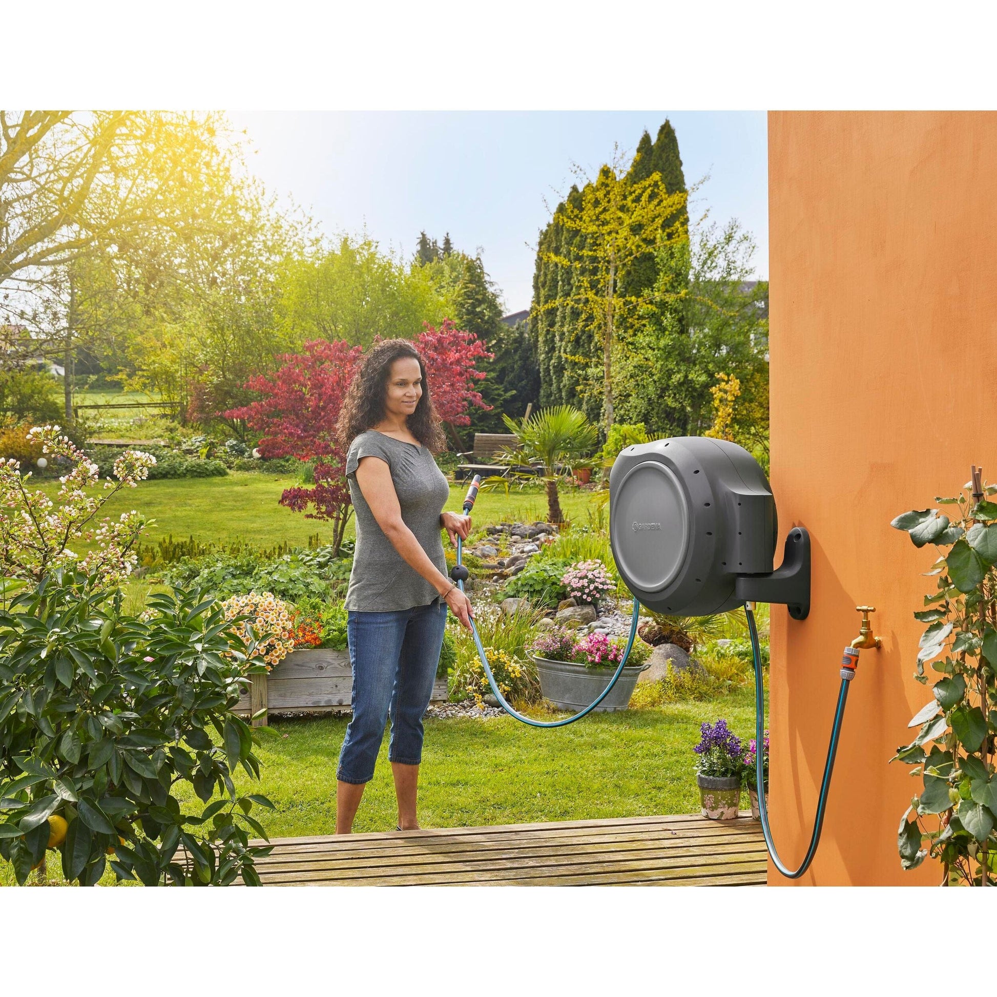 Gardena RollUp 100 ft auto retracting hose reel, gray housing, wall-mounted on Tampa Home & Garden Store