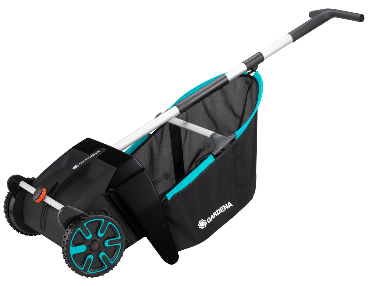 Leaf and Lawn Collector lawn sweeper by Gardena with teal bag trim and large teal wheels on Tampa Home & Garden Store