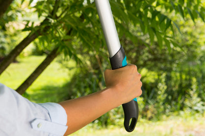 Pruning Lopper EasyCut 680 B Gardena, silver handle with teal grip in use on Tampa Home & Garden Store