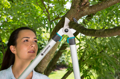 Pruning Lopper EasyCut 680 A by Gardena with teal grips cutting branch on Tampa Home & Garden Store