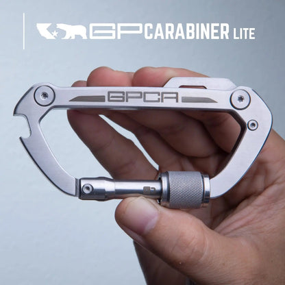 GPCA Carabiner Lite EDC keychain in silver stainless steel with GPCA logo held in hand on Tampa Home & Garden Store
