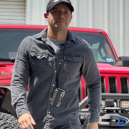 GPCA United-1 Wallet Card Holder, black EDC wallet on a lanyard worn by a man in gray denim on Tampa Home & Garden Store