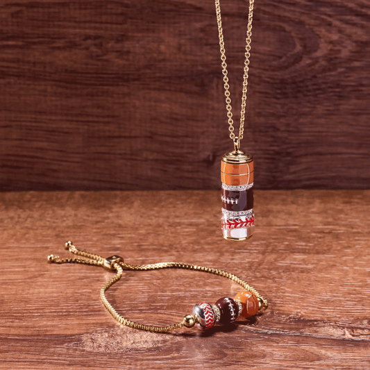 Game On Spinner Pendant necklace by ALEX AND ANI with gold chain and stacked sports beads on Tampa Home & Garden Store