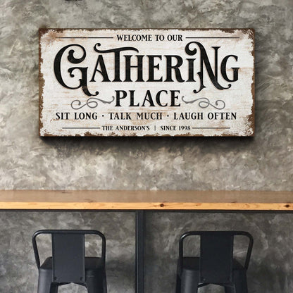 Gathering Place canvas sign with distressed white background and bold ornate black lettering on Tampa Home & Garden Store
