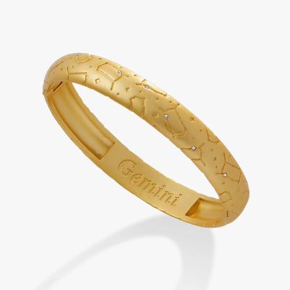 Gemini zodiac hinge bangle in gold tone with constellation engravings on Tampa Home & Garden Store