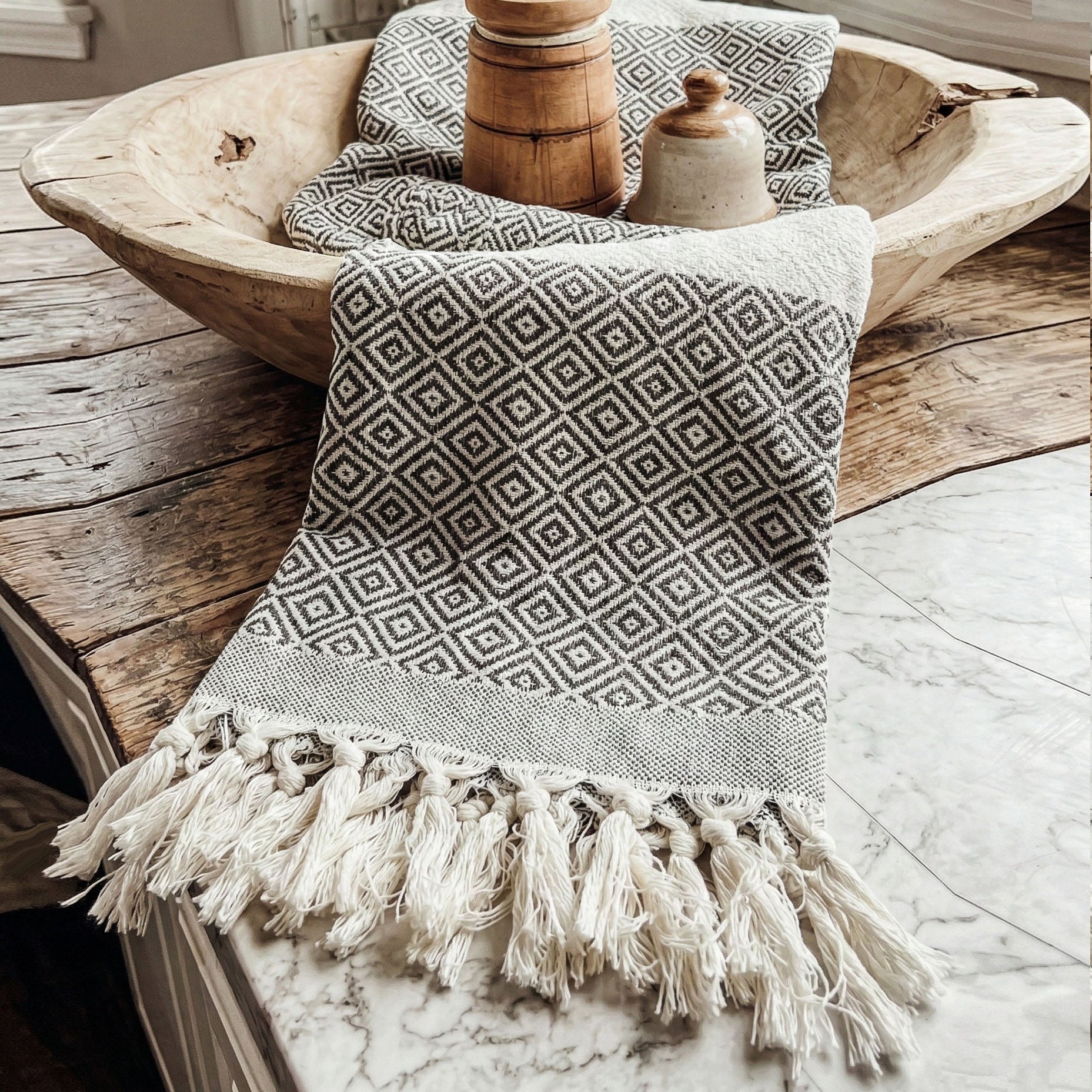 Haley Diamond Towel 200GSM by Gia Roma with black and white geometric pattern and tassels on Tampa Home & Garden Store