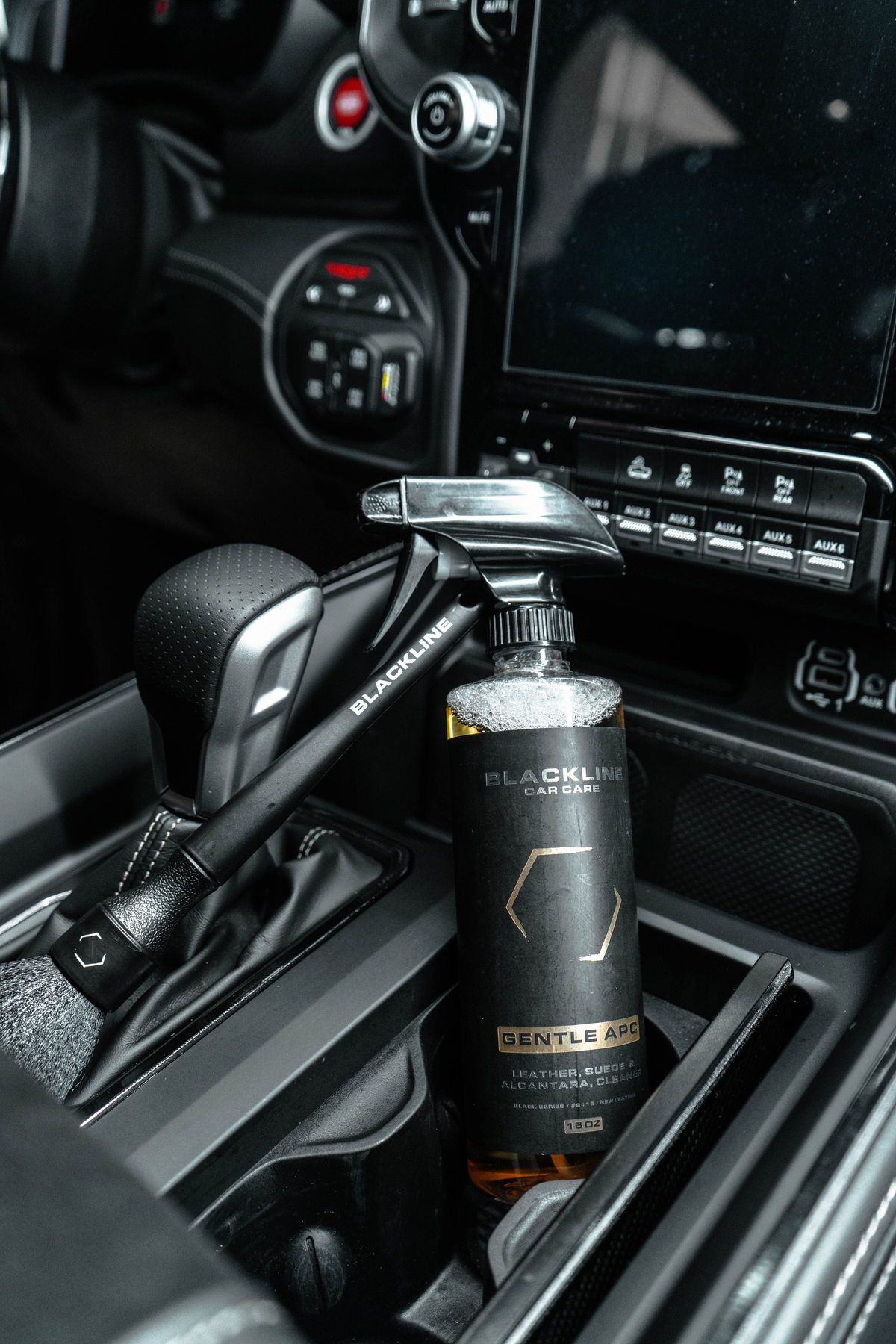 BLACKLINE Car Care Gentle APC all-purpose cleaner spray bottle in a black car interior on Tampa Home & Garden Store