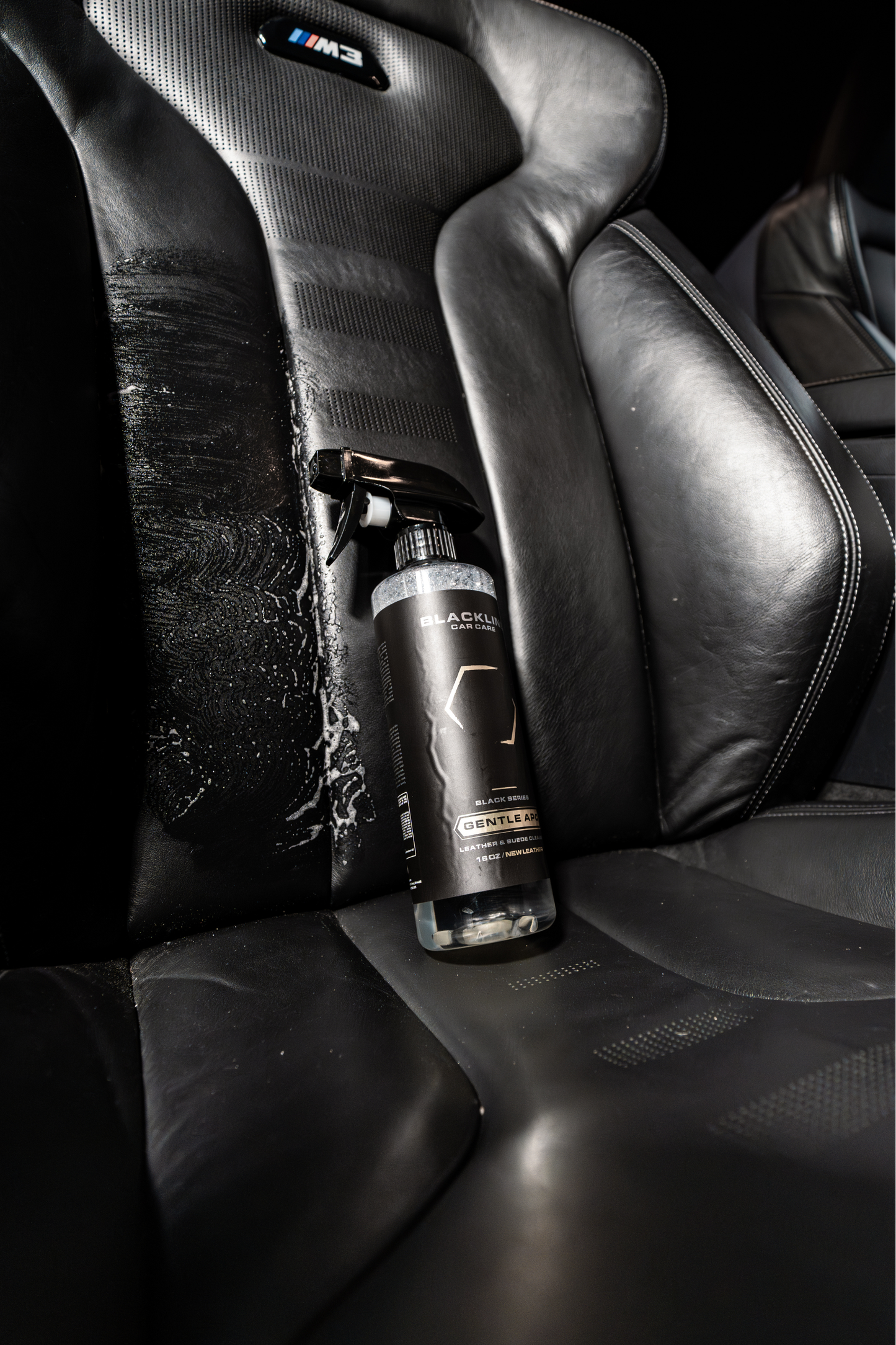 BLACKLINE Gentle APC all purpose cleaner spray bottle on black leather car seats on Tampa Home & Garden Store
