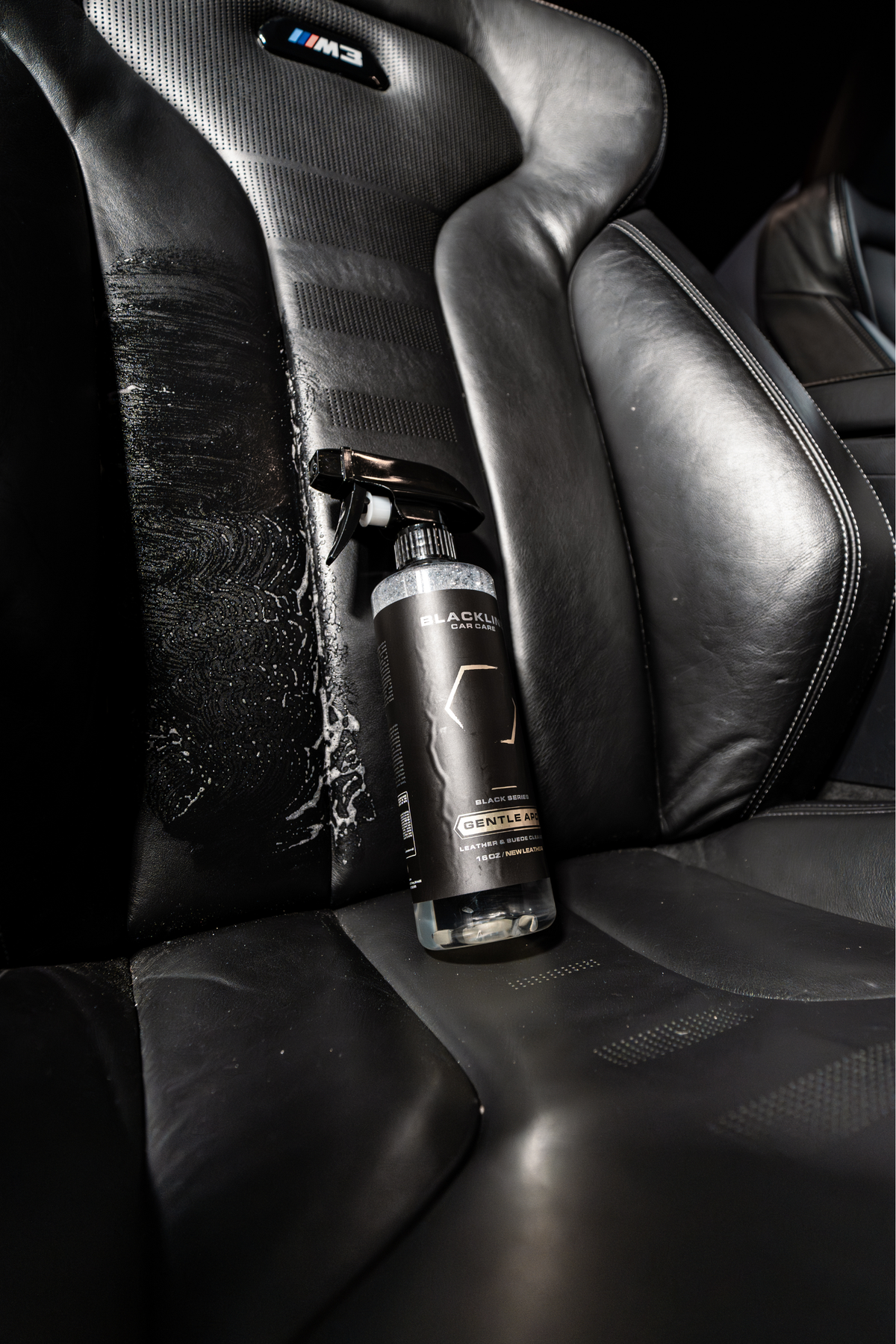BLACKLINE Gentle APC all purpose cleaner spray bottle on black leather car seats on Tampa Home & Garden Store