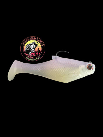 Bacca Burrito boot tail soft swimbait pale white pearl; Lake Baccarac Lodge logo visible on Tampa Home & Garden Store