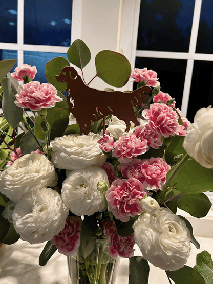 Golden Retriever plant stake metal silhouette rust finish among pink carnations on Tampa Home & Garden Store