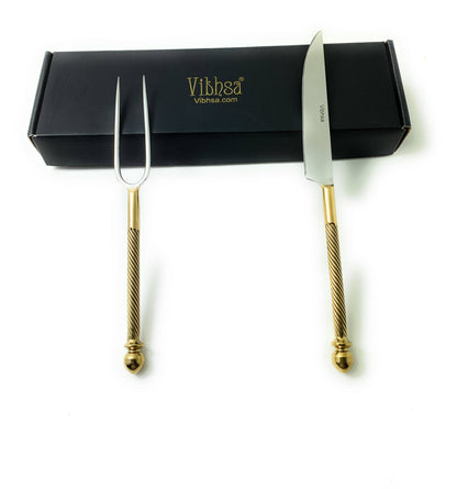 Vibhsa two-piece carving set with gold-accent stainless steel knife and fork on black box on Tampa Home & Garden Store