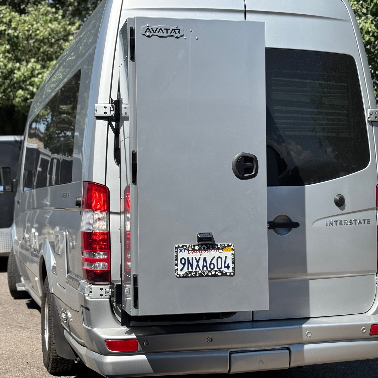Avatar Caddie Storage Box mounted on rear of gray van, metal box with Avatar Offroad logo on Tampa Home & Garden Store