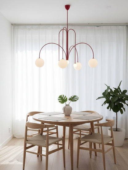 Globella 6-head pendant chandelier with red metal arms and glass globe shades, adjustable drop on Tampa Home & Garden Store