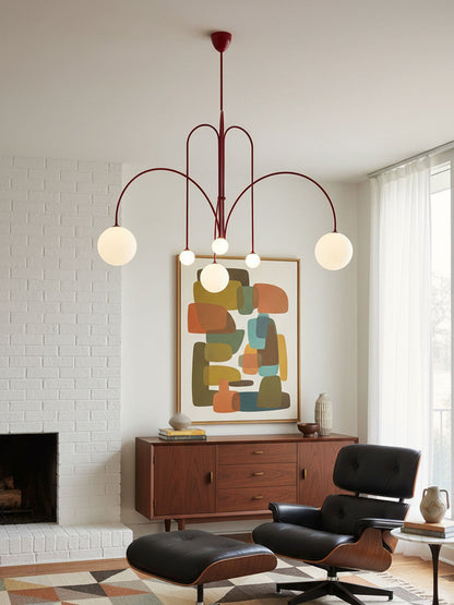 Globella 6-head pendant chandelier with red metal arms and glass globe shades, adjustable drop on Tampa Home & Garden Store