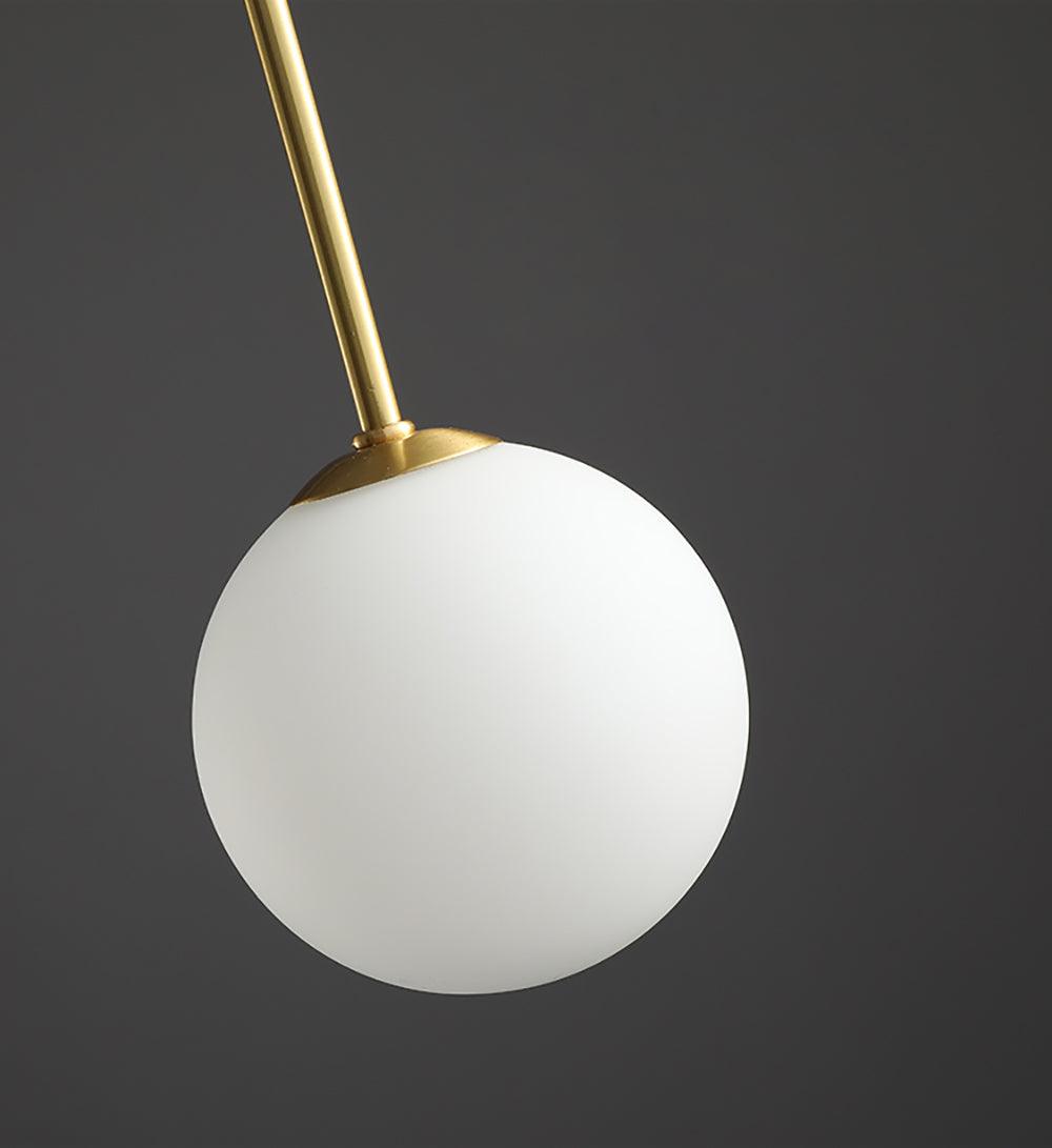 Globella pendant chandelier with white glass globe and gold stem for dining rooms on Tampa Home & Garden Store