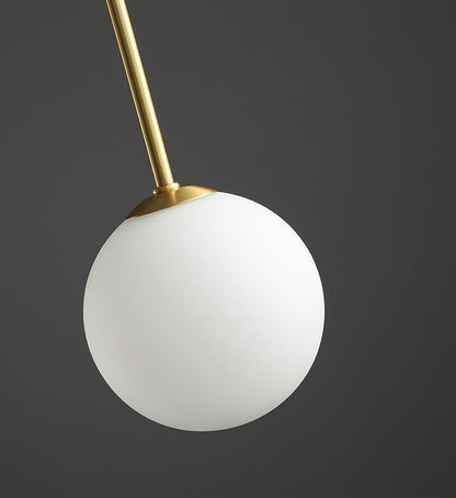 Globella pendant chandelier with white glass globe and gold stem for dining rooms on Tampa Home & Garden Store