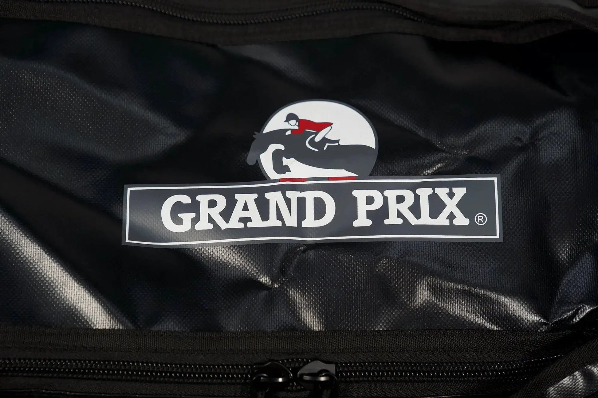 Grand Prix Duffle Backpack Travel Bag in black nylon with white circular rider logo patch on Tampa Home & Garden Store