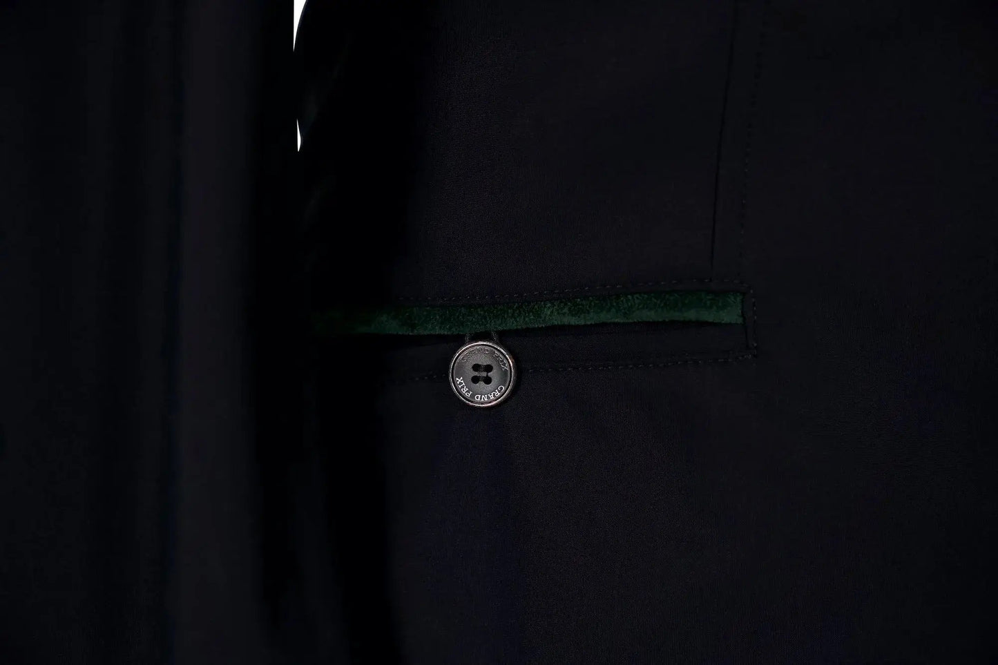 Grand Prix Saltare Premio riding coat in black with dark green velvet trim and Grand Prix button on Tampa Home & Garden Store
