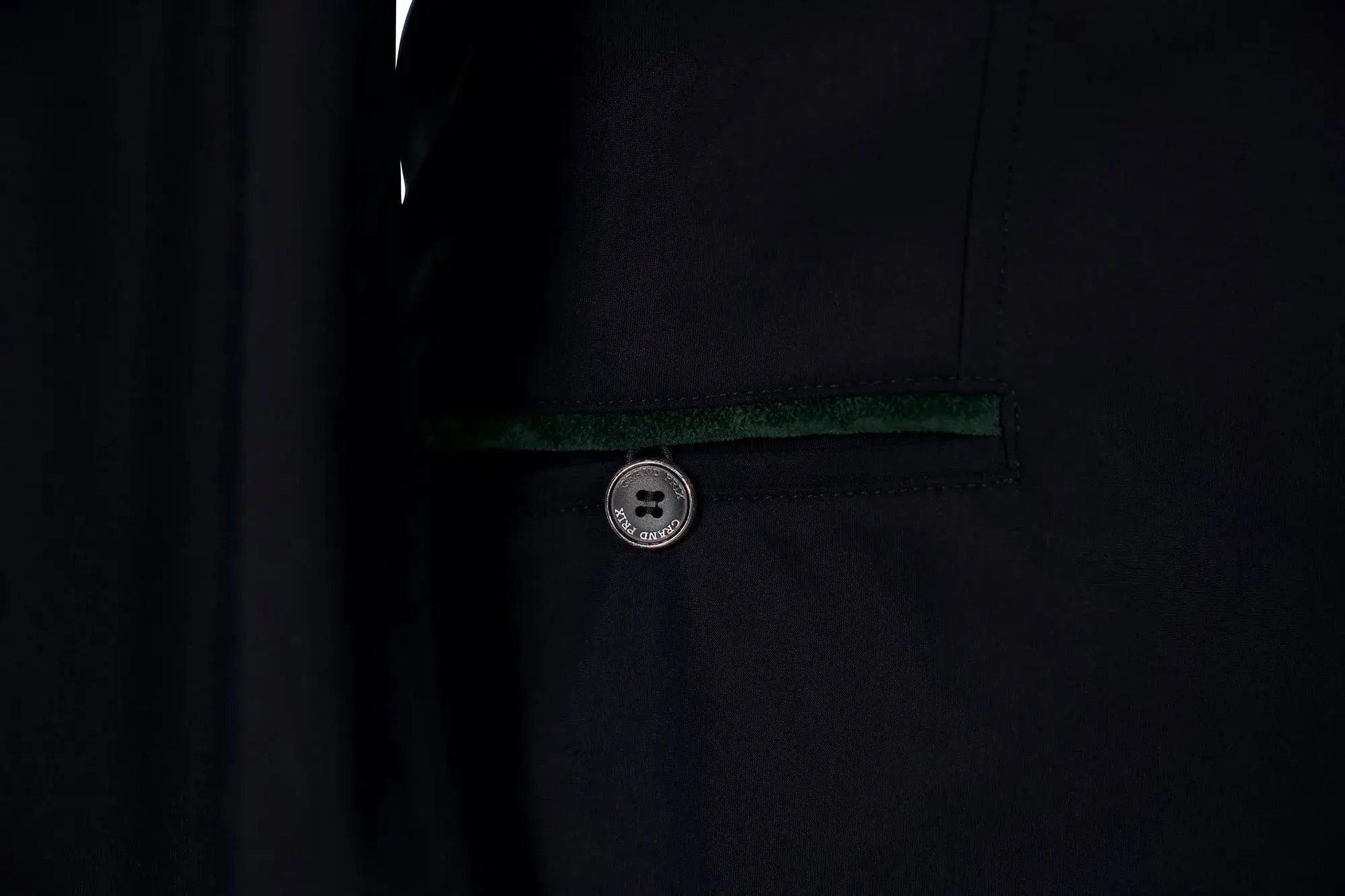 Grand Prix Saltare Premio riding coat in black with dark green velvet trim and Grand Prix button on Tampa Home & Garden Store