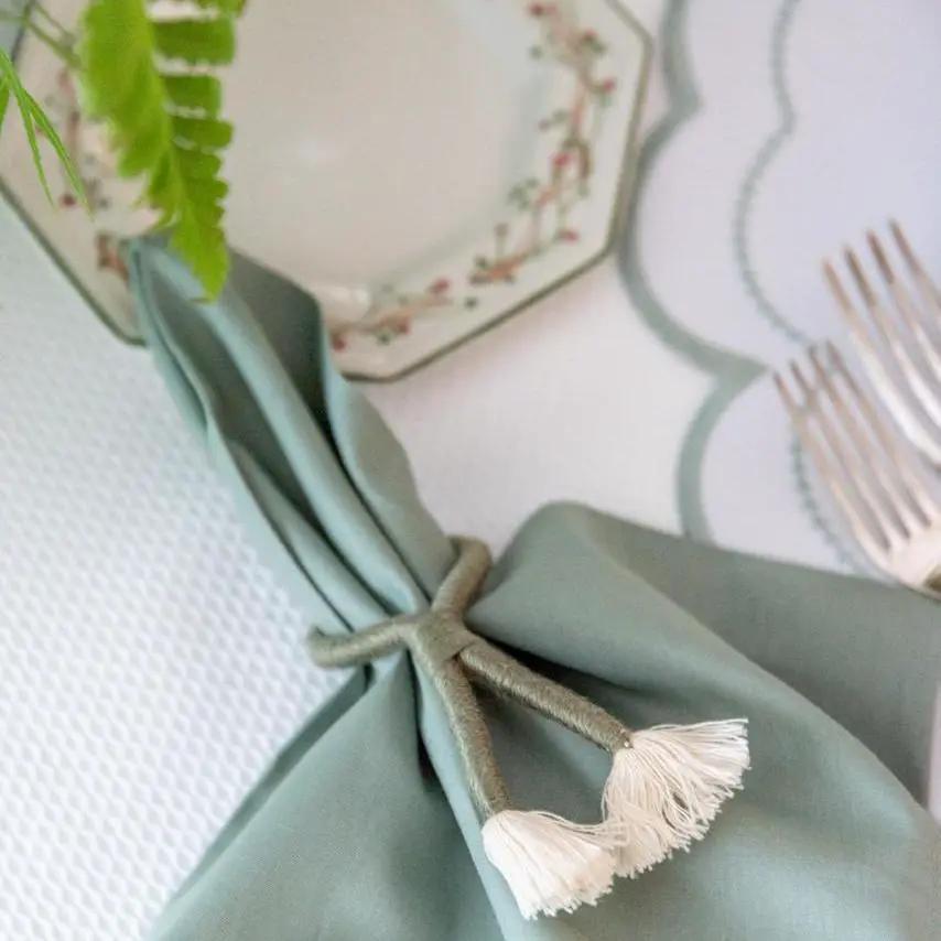 Nautical Knot Napkin Ring by Talah Home with beige rope tassels and sage napkin on Tampa Home & Garden Store