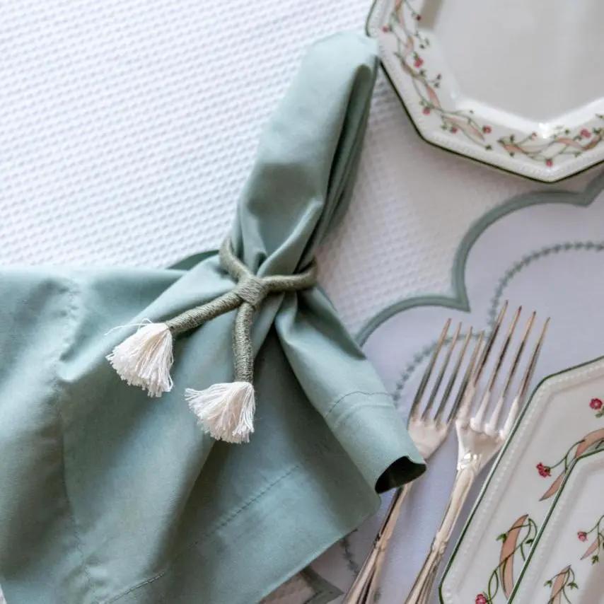 Nautical knot napkin ring holder with a light blue napkin and tassel cord by Talah Home on Tampa Home & Garden Store