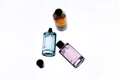 Fragrance The Scent Edit body mists by Bravo Sierra four blue orange pink and purple bottles arranged diagonally on Tampa Home & Garden Store