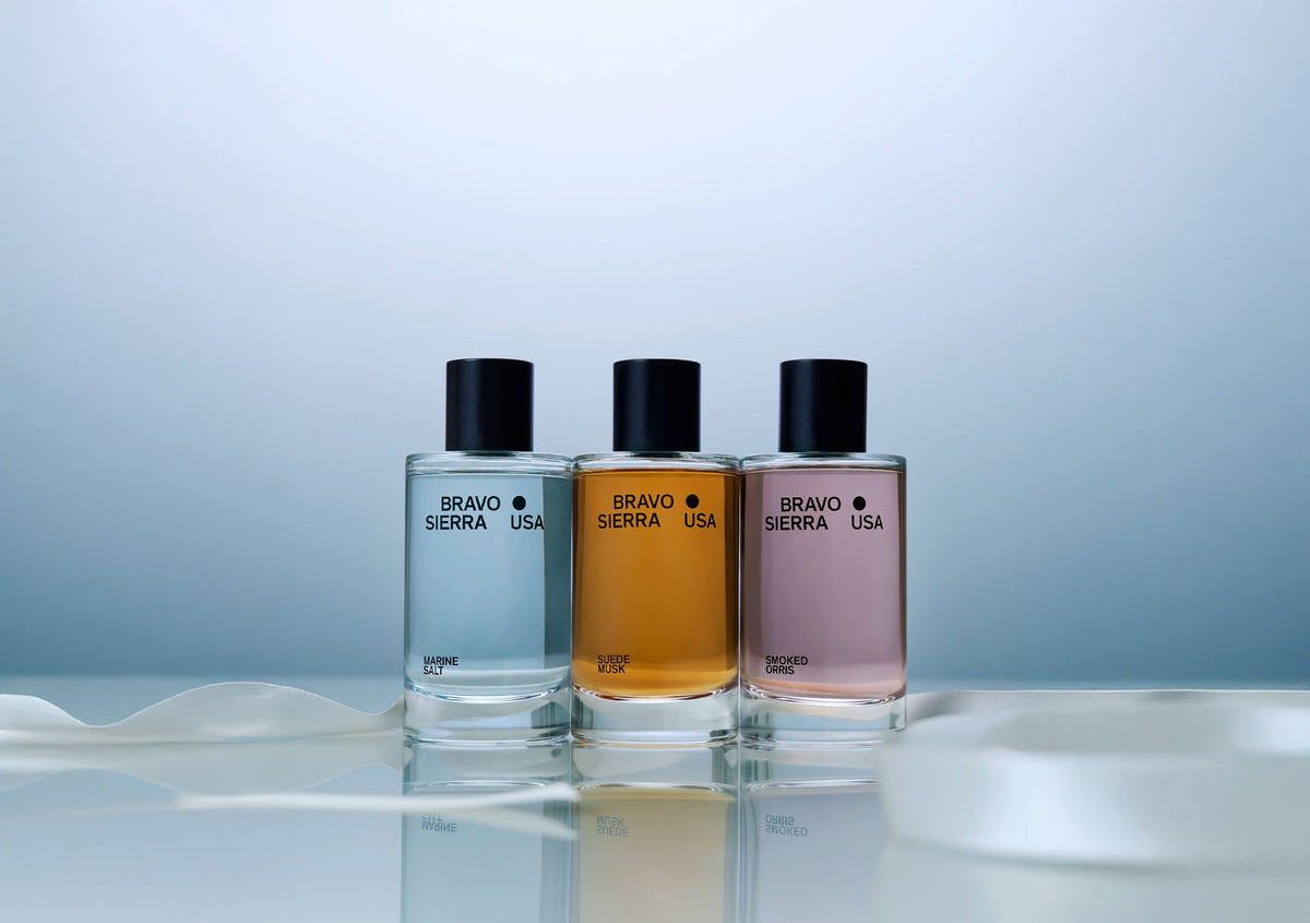 Bravo Sierra fragrance body mists trio in Marine Salt blue, Suede Musk amber, Smoked Orris pink bottles on Tampa Home & Garden Store