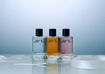 Bravo Sierra fragrance body mists trio in Marine Salt blue, Suede Musk amber, Smoked Orris pink bottles on Tampa Home & Garden Store