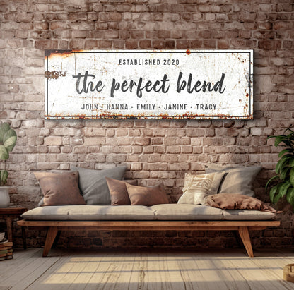 Canvas sign The Perfect Blend on a rustic distressed white panel against a brick wall on Tampa Home & Garden Store