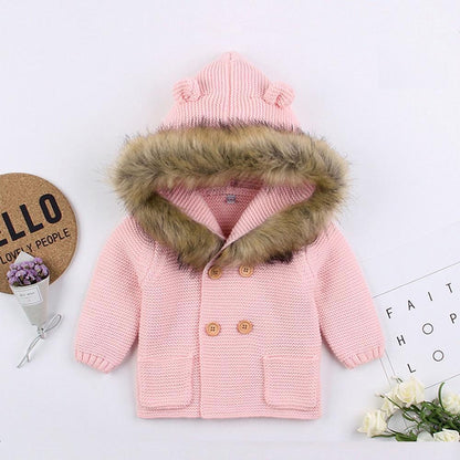Pink knitted newborn baby coat with fur-trimmed hood and double wooden buttons Stevvex on Tampa Home & Garden Store