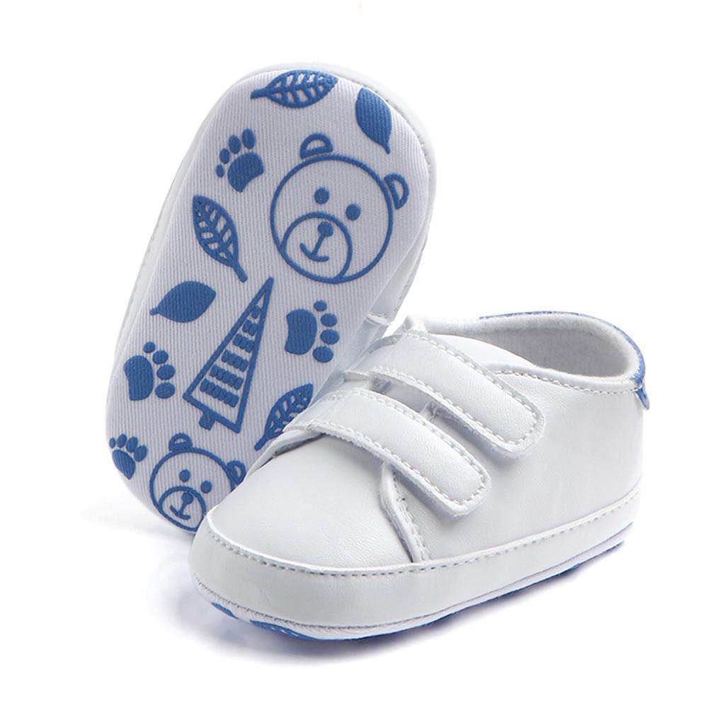 Stevvex white baby soft-sole shoes with two Velcro straps; pair with blue bear and leaf sole print on Tampa Home & Garden Store