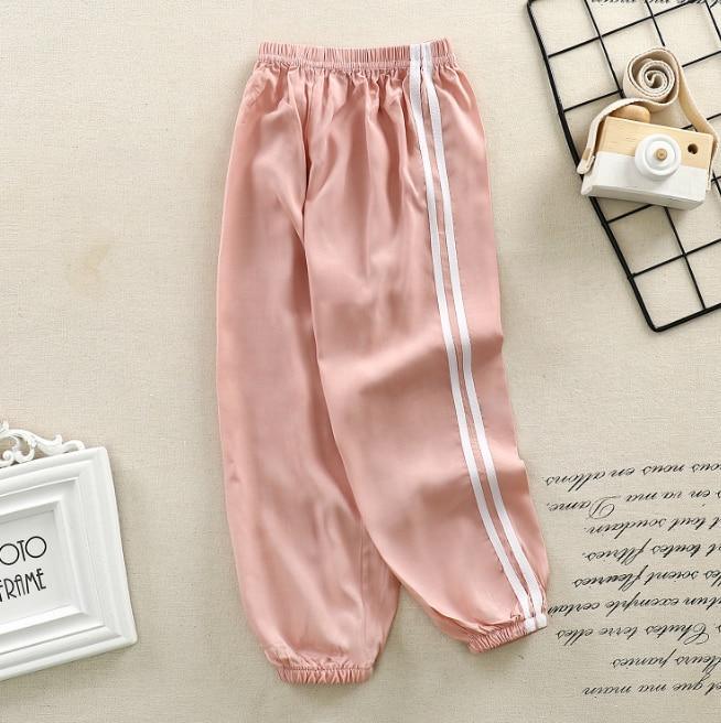 Pink satin kids sport pants with white side stripes, elastic waistband, cuffed ankles Stevvex on Tampa Home & Garden Store