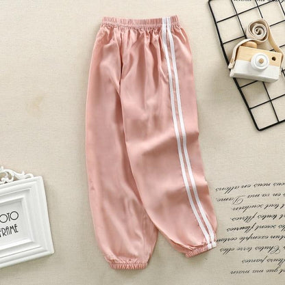 Pink satin kids sport pants with white side stripes, elastic waistband, cuffed ankles Stevvex on Tampa Home & Garden Store
