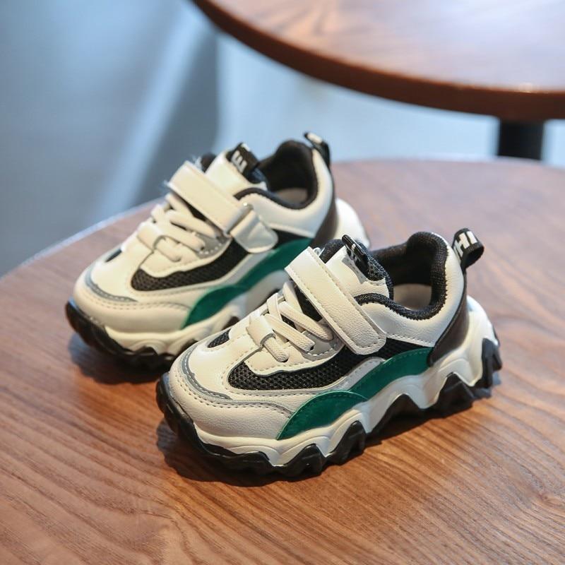 Casual kids sneakers: two white mesh sneakers with black trim and green accents; Velcro on Tampa Home & Garden Store