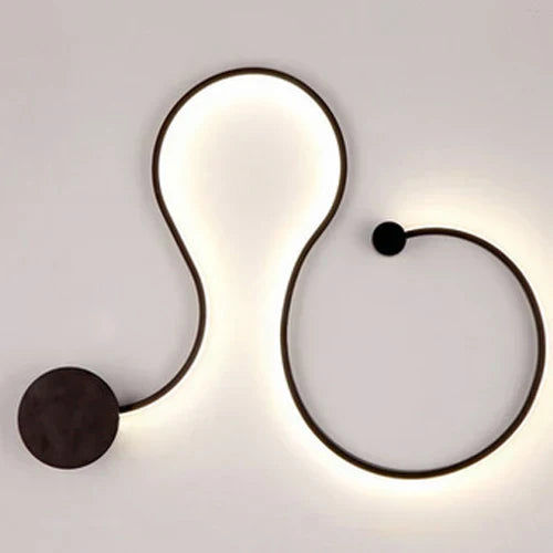 DecorBites LED aluminum wall lamp with curved abstract design and warm glow on Tampa Home & Garden Store