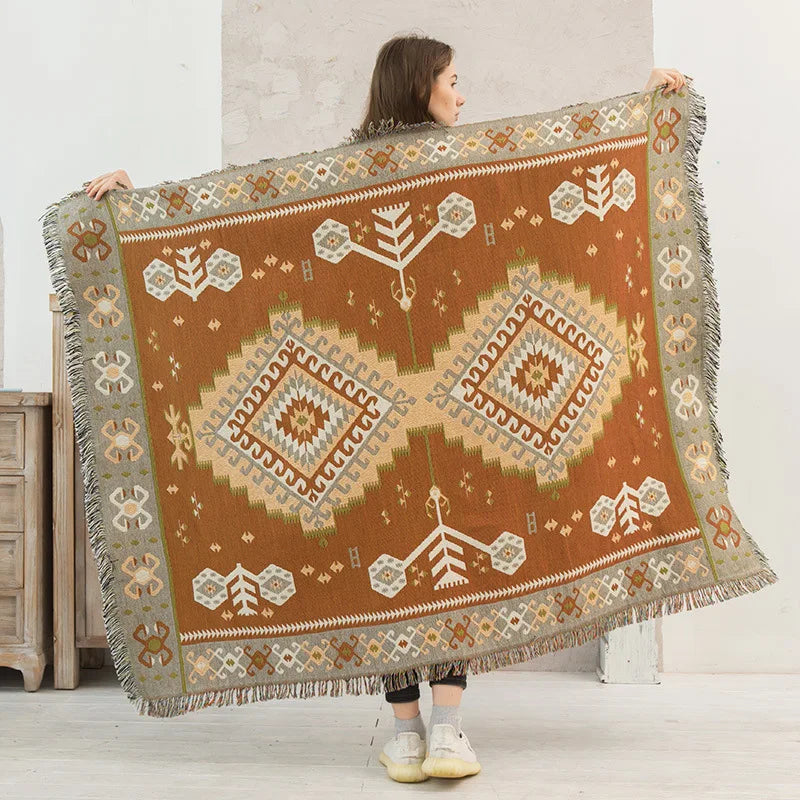 DecorBites Knitted Nordic Plaid Blanket in brown/beige with fringe edges on Tampa Home & Garden Store