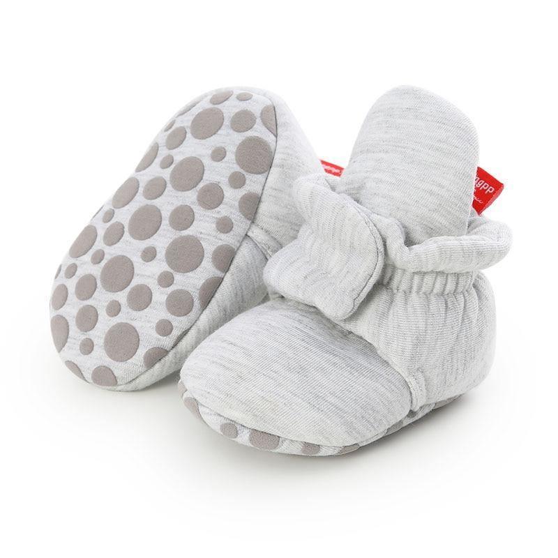 Stevvex baby booties pair in grey faux fleece with knit cuffs and dotted sole on Tampa Home & Garden Store