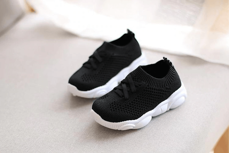 Stevvex baby sneakers pair black knit upper with white anti-slip sole for toddlers on Tampa Home & Garden Store