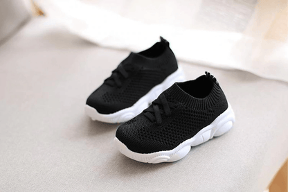 Stevvex baby sneakers pair black knit upper with white anti-slip sole for toddlers on Tampa Home & Garden Store