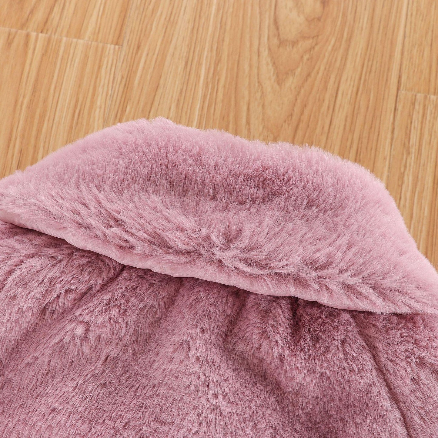 New luxury baby fur cloak jacket Stevvex pink plush fur closeup on wooden floor on Tampa Home & Garden Store